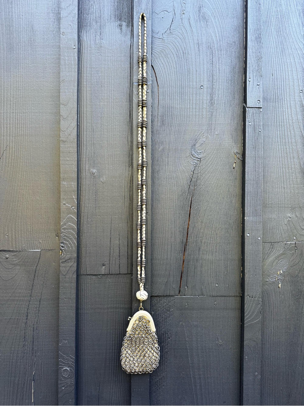 Beaded “chain mail” mini pouch bag with long bead and leather strap